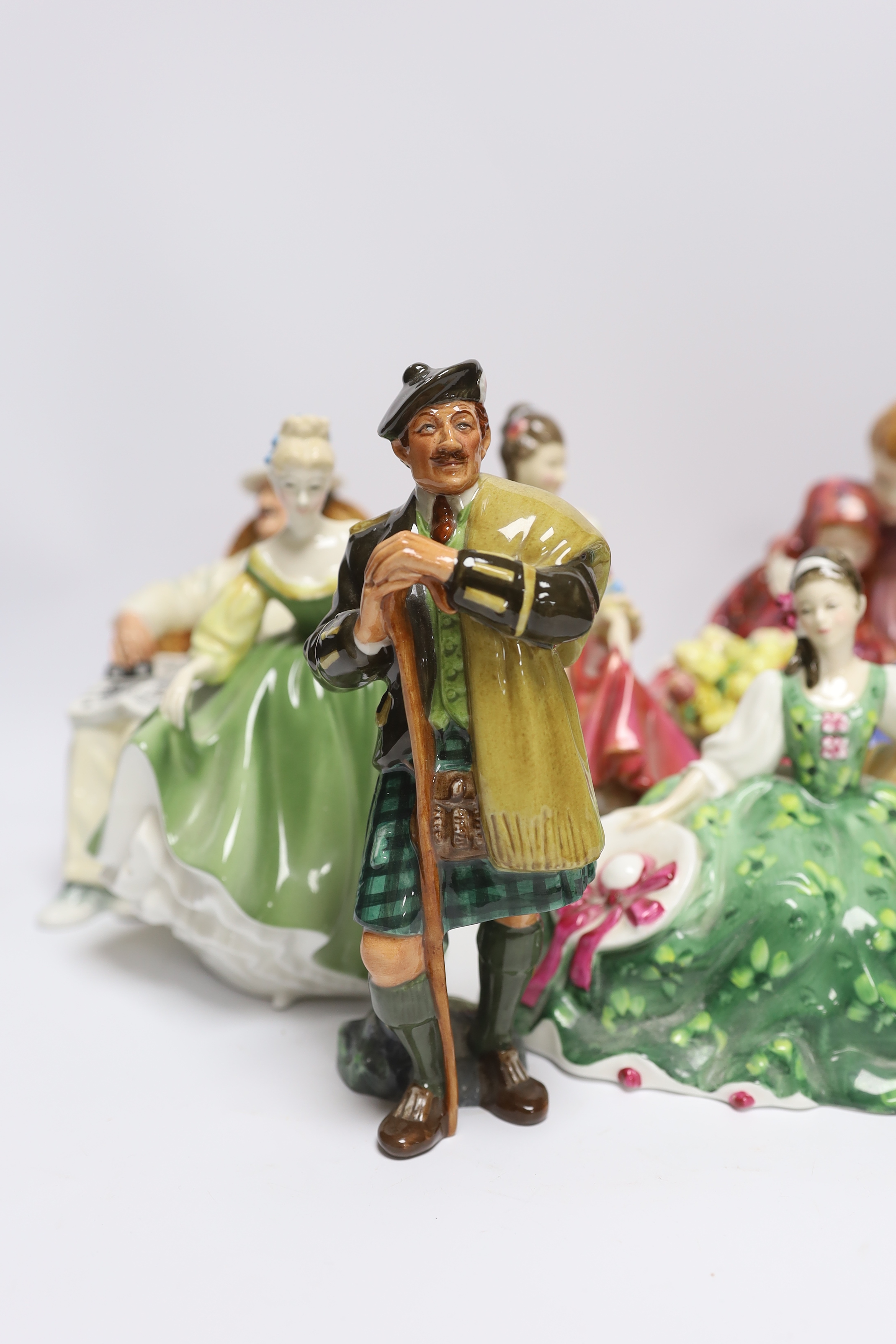 Six various Royal Doulton figures - Southern Belle, Taking Things Easy, Fair Lady, The Laird, Elyse and Flower Sellers Children